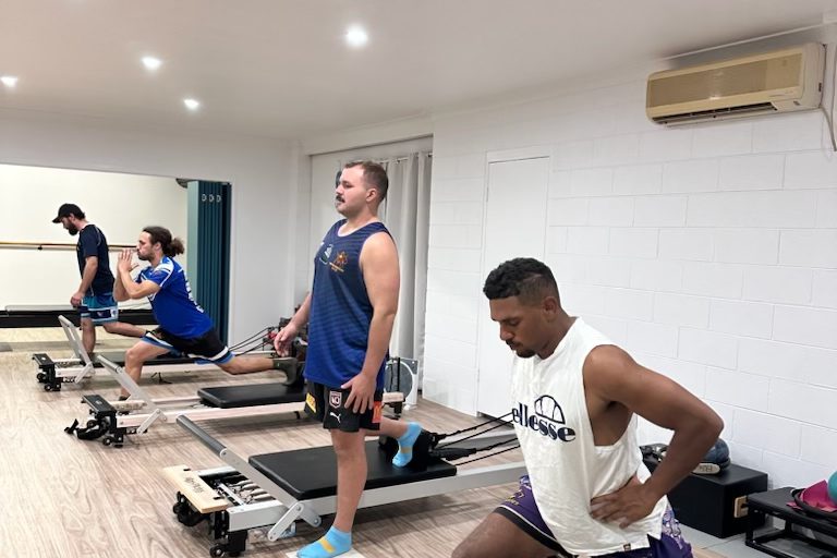 Clients working on the reformers in a group class at Pilates Rockhampton