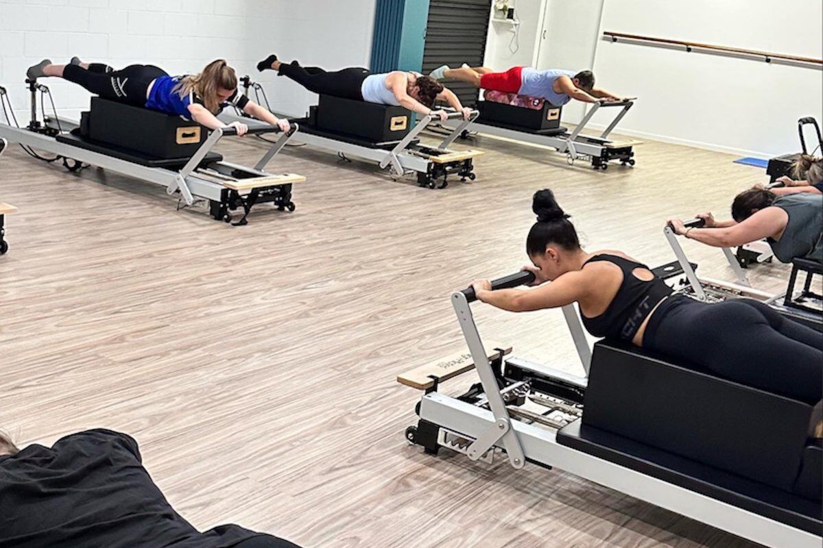 A reformer class at Pilates Rockhampton working on the boxes